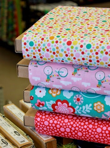 Cute stack of Fancy Free fabric by Riley Blake
