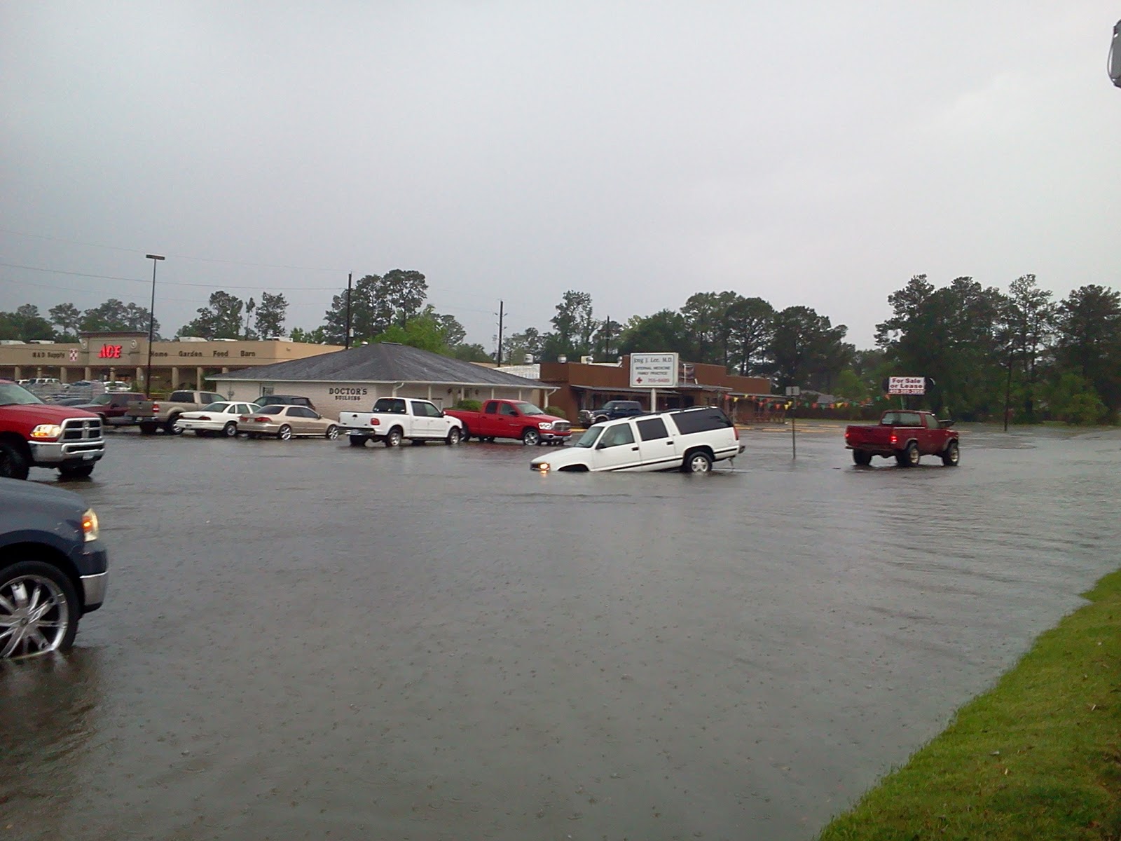 Lumberton Texas flash flooding. Cars in ditches and roads flooded