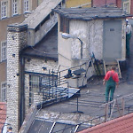 Polish workers on a roof.