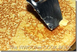 Melting the butter on a hot pancake