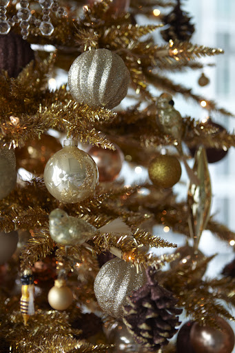 I also mixed in some cream-colored ornaments with the silver and gold.