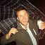 Singing in the rain! He was going to bust out some George Samson breakdancing moves, but didn't want to spill his beer.