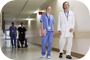 Doctor and Nurse Walking down Hallway --- Image by © Shine Pictures/Corbis