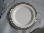 Here's a plate by Match. It's pewter rim adds a really nice weight to the plate and an interesting take on the metallic border.
