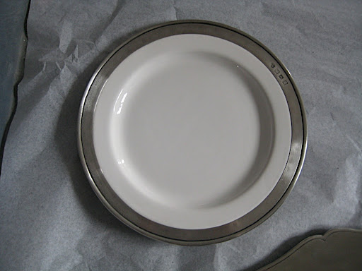 Here's a plate by Match. It's pewter rim adds a really nice weight to the plate and an interesting take on the metallic border.