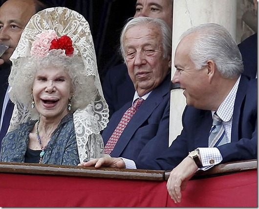 Bullfighting celebrated on the ocassion of the Feria de Abril (April's Fair) at Real Maestranza bullring in Seville...epa02130682 Cayetana Fitz-James Stuart (L), 18th Duchess of Alba, chats with the Director of Ceremonies of the Real Maestranza bullring Alfonso Guajardo-Fajardo (R) as professor of Commercial Law Manuel Olivencia (C) looks on during a bullfighting celebrated on the ocassion of the Feria de Abril (April's Fair) at Real Maestranza bullring in Seville, Andalusia, southern Spain, 24 April 2010. April's Fair, also known as Seville's Fair, is a week long festival where visitors can enjoy food, drink, parades, traditional costumes, bullfighting and flamenco.  EPA/JULIO MUNOZ