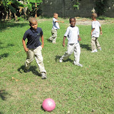 Arturo, Raidi, Wilson and Anthony playing soccer.