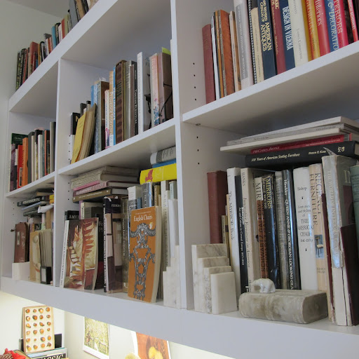 Fritz's bookshelves are filled to the brim with books on history and collecting.