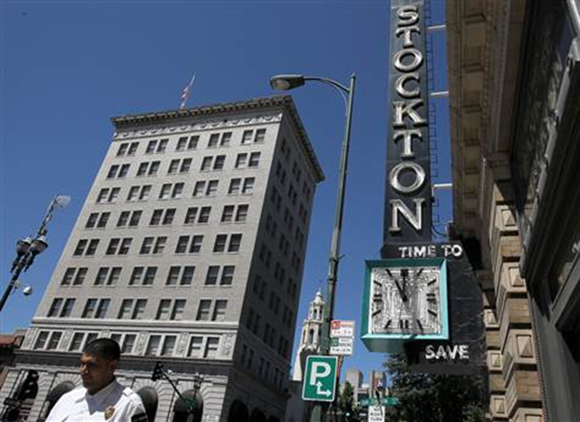 A pedestrian walks by the vacant Bank of Stockton on 27 June 2012. Justin Sullivan  /  Getty Images