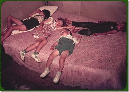 Children asleep on bed during square dance. McIntosh County, Oklahoma, 1939 or 1940. Reproduction from color slide. Photo by Russell Lee. Prints and Photographs Division, Library of Congress