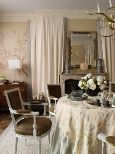 The chair coverings add a bit of drama to the room's mostly neutral tones. (Matthew Patrick Smyth, Inc.)