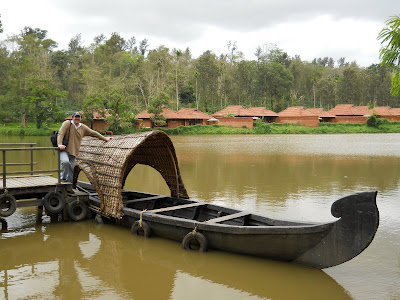 You can feed the fish and take a little tour around the lake from this boat. And you can see our house (for our stay) in the background