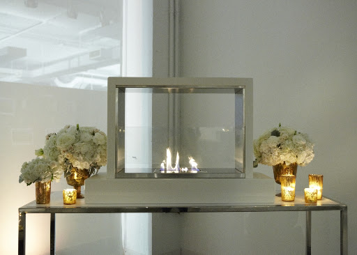Gorgeous arrangements flanked the Taylor Creative fireplace in a lounge. Gorgeous arrangements flanked the Taylor Creative fireplace in a lounge.