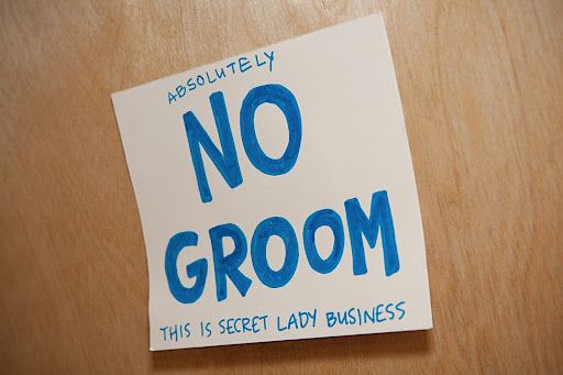 A witty sign for the girls' prep room.