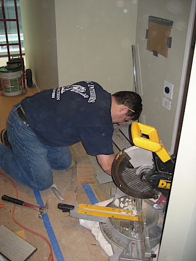 Hard at work patching up the floor.