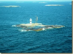 Small Island and lighthouse sail away (Small)