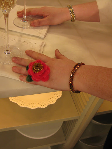 One of the staff members shows off her pipe cleaner bling. One of the staff members shows off her pipe cleaner bling.