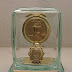If you are a demanding person looking for a distinguished trophy, we highly suggest that you opt for one of our Jewel Box Series. The JB (jewel box) trophies are composed of one or more gold plated medal mounted on a gold plated plate decorated with a gold plated decoration. All are shaped and engraved to embody your message. All are treasured and preserved in a very accurately cut and beveled glass box; it makes your trophy appear like a rare gem. All are boxed in a luxury velvet or wooden box.