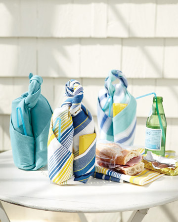 These neat bundles have everything you need for a picnic meal, including a handle to transport them. With a few quick folds and a knot, you can transform a dish towel into a carrier for a sandwich and drink. Once you're at your destination, use the towel as a place mat or napkin. (marthastewart.com/how-to/dish-towel-picnic-carrier)