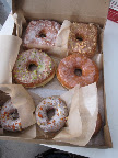 From back left: Coconut Cream, Peanut Butter and Jelly, Vanilla Glaze, Carrot Cake, Pistachio. From back left: Coconut Cream, Peanut Butter and Jelly, Vanilla Glaze, Carrot Cake, Pistachio.