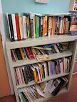 A case of cookbooks provides inspiration for new recipes and helps students learn about unfamiliar cuisines.