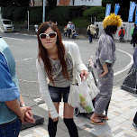 Japanese girl wearing white shades on Jingu bridge in Harajuku, Japan 