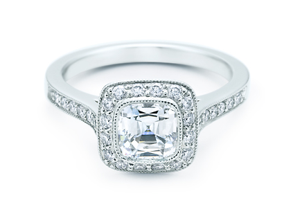 The Tiffany Legacy features a cushion modified brilliant cut diamond in a lavish diamond-encrusted setting. We adore its vintage feel. The Tiffany Legacy features a cushion modified brilliant cut diamond in a lavish diamond-encrusted setting. We adore its vintage feel.
