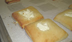 We rolled out brioche and then covered it with egg wash. Goat cheese rounds were placed in the center before it was baked. These were a hit with hungry bread makers.