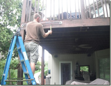 hanging an outdoor curtain rod Ryan hanging the curtain rod