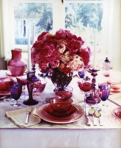 A hundi shade throws a rosy cranberry glow over mismatched pieces spanning a century of glassmaking. (Martha Stewart Living) A hundi shade throws a rosy cranberry glow over mismatched pieces spanning a century of glassmaking. (Martha Stewart Living)