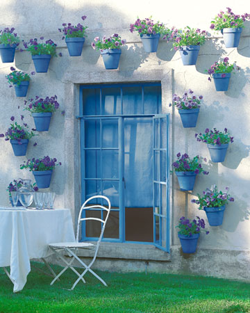 There's endless ways you can use pots to decorate your outdoor living space this summer. Check out marthastewartliving.com/photogallery/garden-containers for potting how-to's and decorating projects. Have fun!