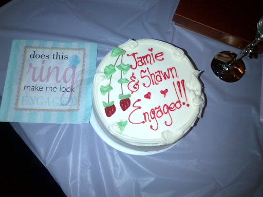 The parents brought a celebratory cake, napkins, and Champagne flutes to kick off the engagement. The parents brought a celebratory cake, napkins, and Champagne flutes to kick off the engagement.