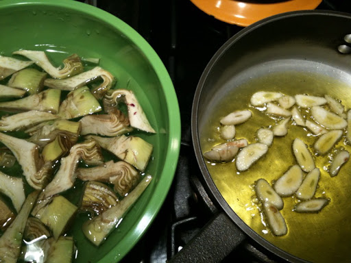 Garlic and olive oil getting ready for the artichokes.