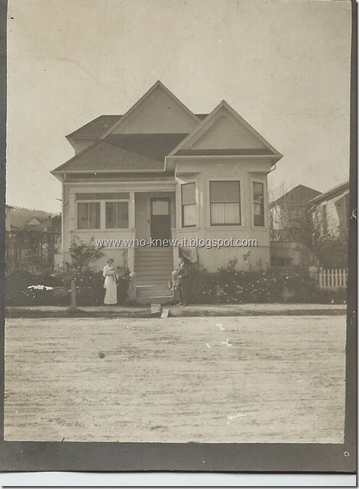 Loraine in front of house