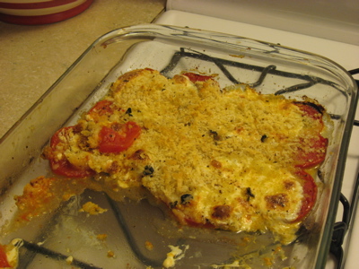 A half-eaten tomato bake. A half-eaten tomato bake.