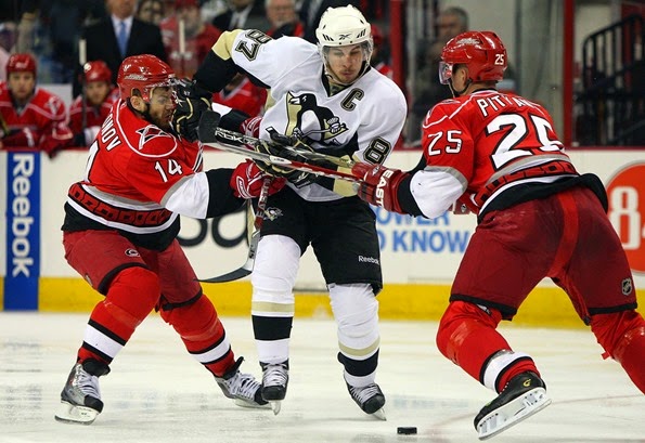 Sidney-Crosby-87-of-the-Pittsburgh-Penguins-skates-against-Sergei-Samsonov