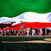 Iranian Election Protests in Washington, D.C., UNITED STATES OF AMERICA Democracy is... many and it is one. It is large and it is small. It is standing under harsh, beating sun and joining together to make shelter. Taken during a protest in front of the White House during the Iranian election crisis in June 2009., Democracy Photo Challenge Finalists