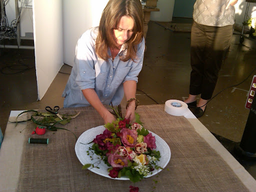 Livia, from The Green Vase, builds a bouquet.