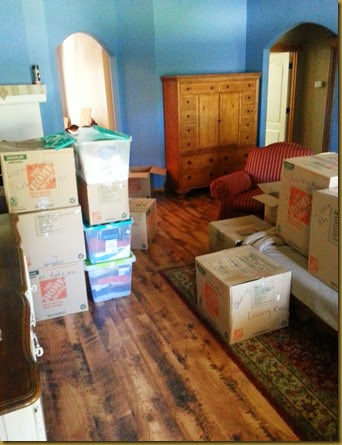 The blue living room with boxes everywhere living room unpacking1