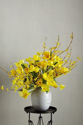 This arrangement was inspired by ikebana, the Japanese art of flower arranging. Since tulip stems continue to grow even after they're cut, this arrange will change everyday. I positioned the tall branches on one side and the short ones opposite. This arrangement was inspired by ikebana, the Japanese art of flower arranging. Since tulip stems continue to grow even after they're cut, this arrange will change everyday. I positioned the tall branches on one side and the short ones opposite.