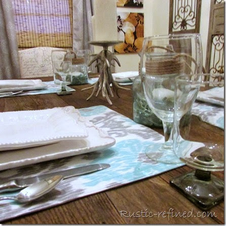 This tablescape was inspired by the temperatures outside. Using cool colors of water and a cold grey sky, I set a modern yet beachy table