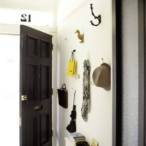Hanging belongings on a collection of different hooks adds personality to an entryway. (apartmenttherapy.com) Hanging belongings on a collection of different hooks adds personality to an entryway. (apartmenttherapy.com)