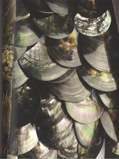 The body of the dress is made from seashells. The body of the dress is made from seashells.