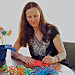 Berta signs a table setting for Brother Sun.