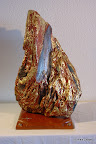 185 - Flamme - 2007<br />
H 55 x 50 - Poids 5,7 Kg<br />
Feuille d'or et de cuivre sur bois