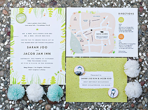 The full invitation suite, including buttons that match, photographed with Joo's yarn pom poms.
Photo by April Smith. The full invitation suite, including buttons that match, photographed with Joo's yarn pom poms.
Photo by April Smith.