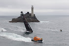 IRELAND, Fastnet Rock. 2nd July 2012. Volvo Ocean Race, Leg 9, Lorient to Galway. Abu Dhabi Ocean Racing rounds the Fastnet Rock.