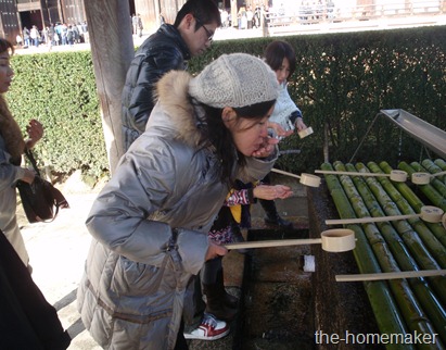 Taking holy water in Todaiji Temple, Nara