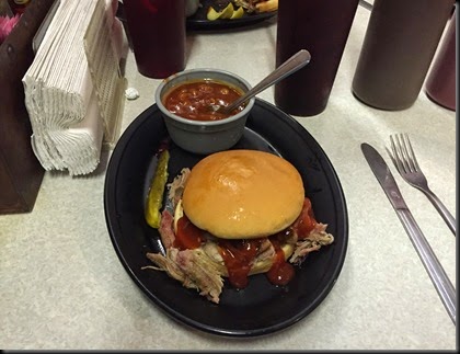 beef & pork on a bun with beans at Smokey's BBQ