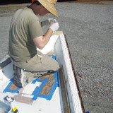 The white is sealant, but we are also gluing the caprail to the rubrail, and screwing them together